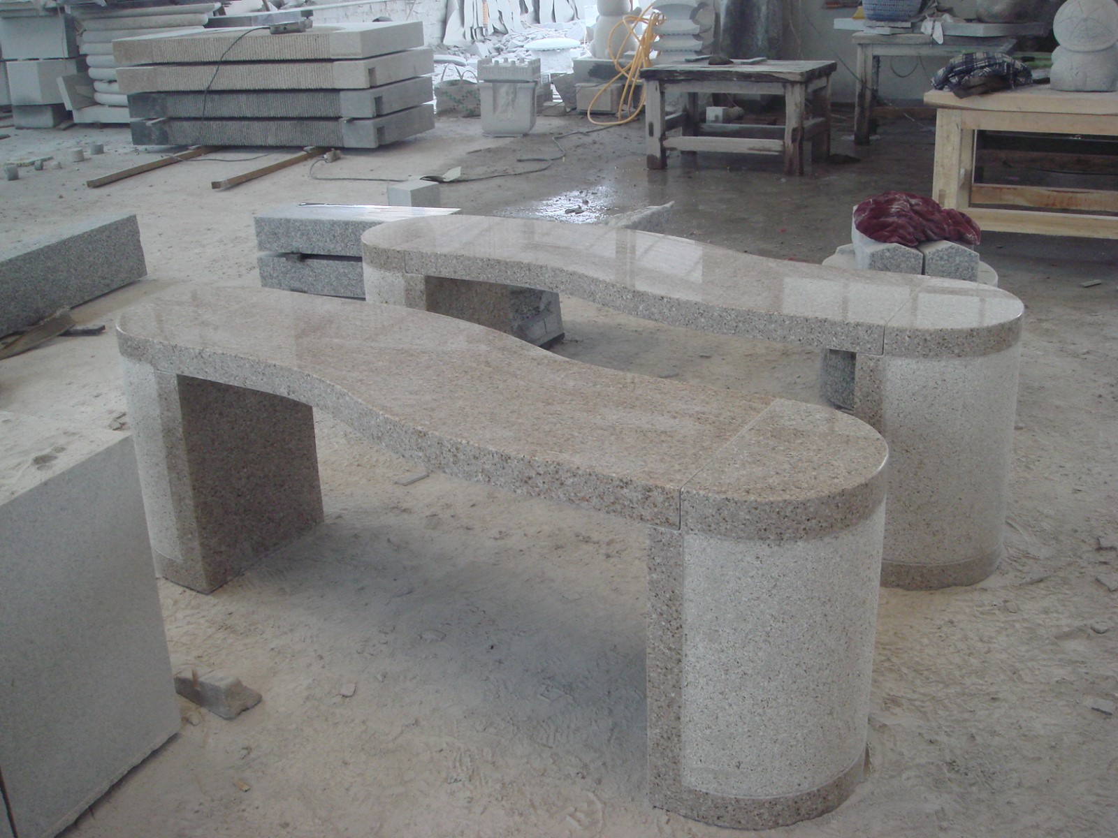 S-shape bench by brown granite.JPG